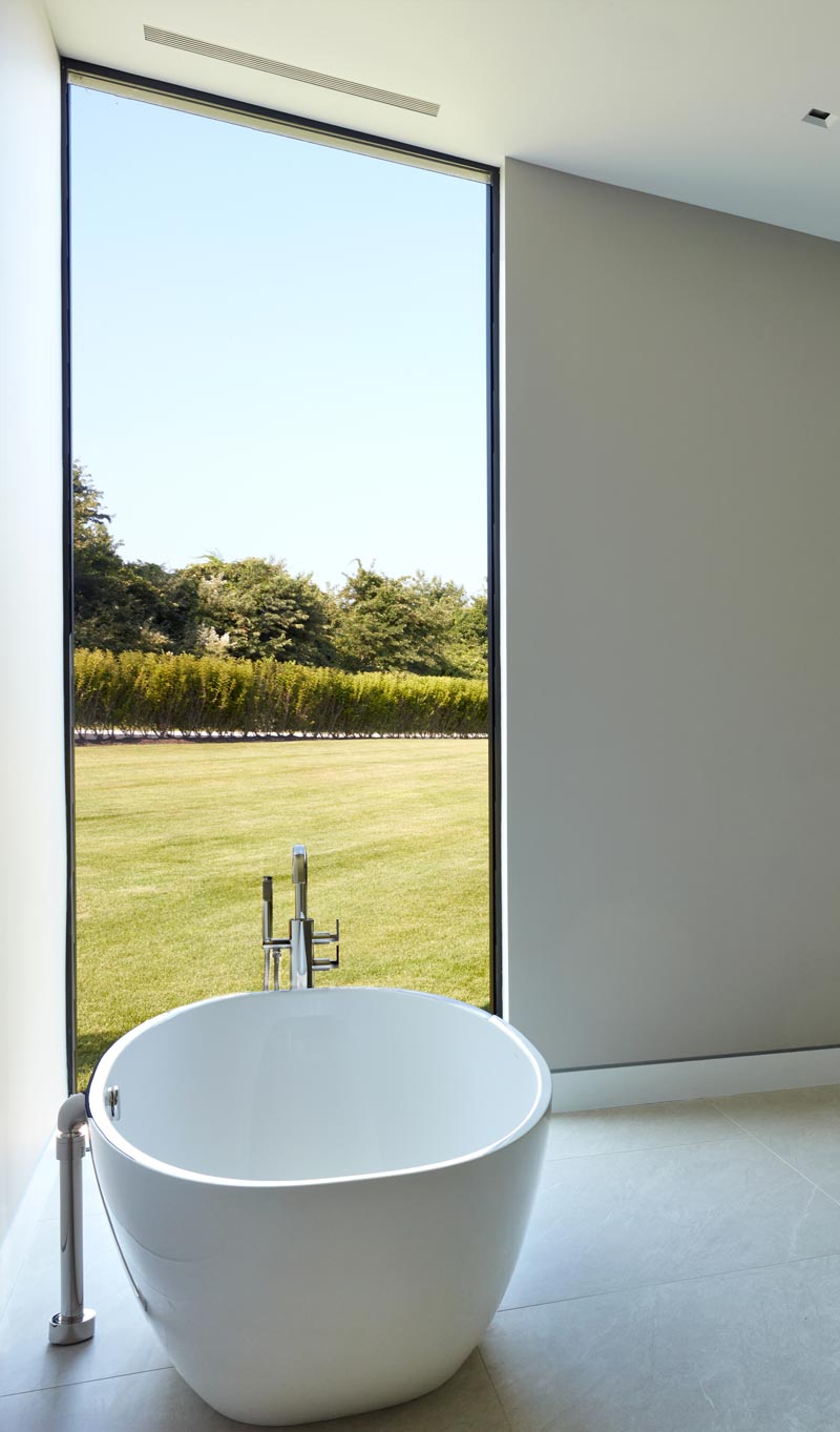 modern bathroom interiors with private nature views from tub