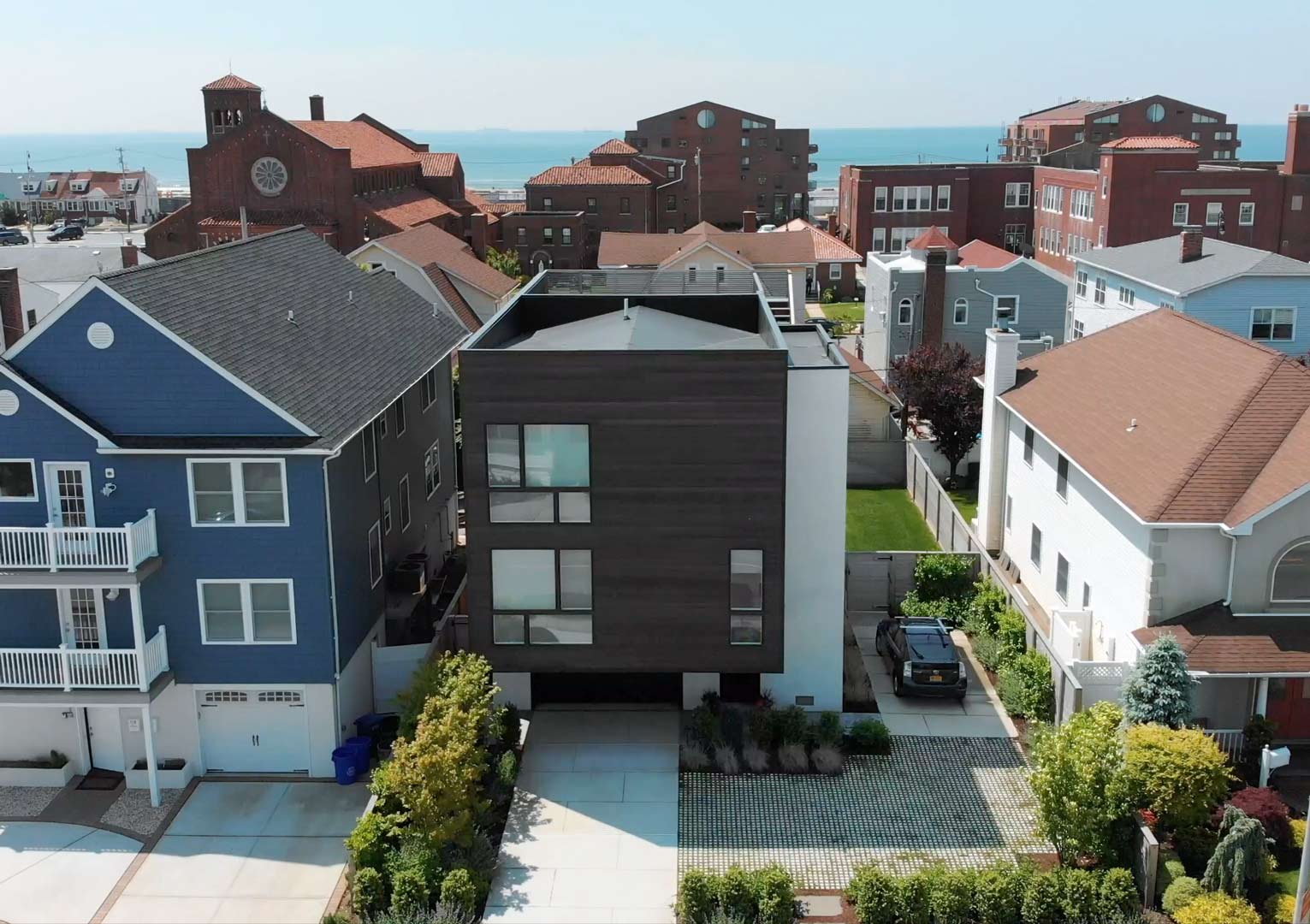 Long Beach NY Sustainable Black Modern Home with Roof Deck and Solar Panels